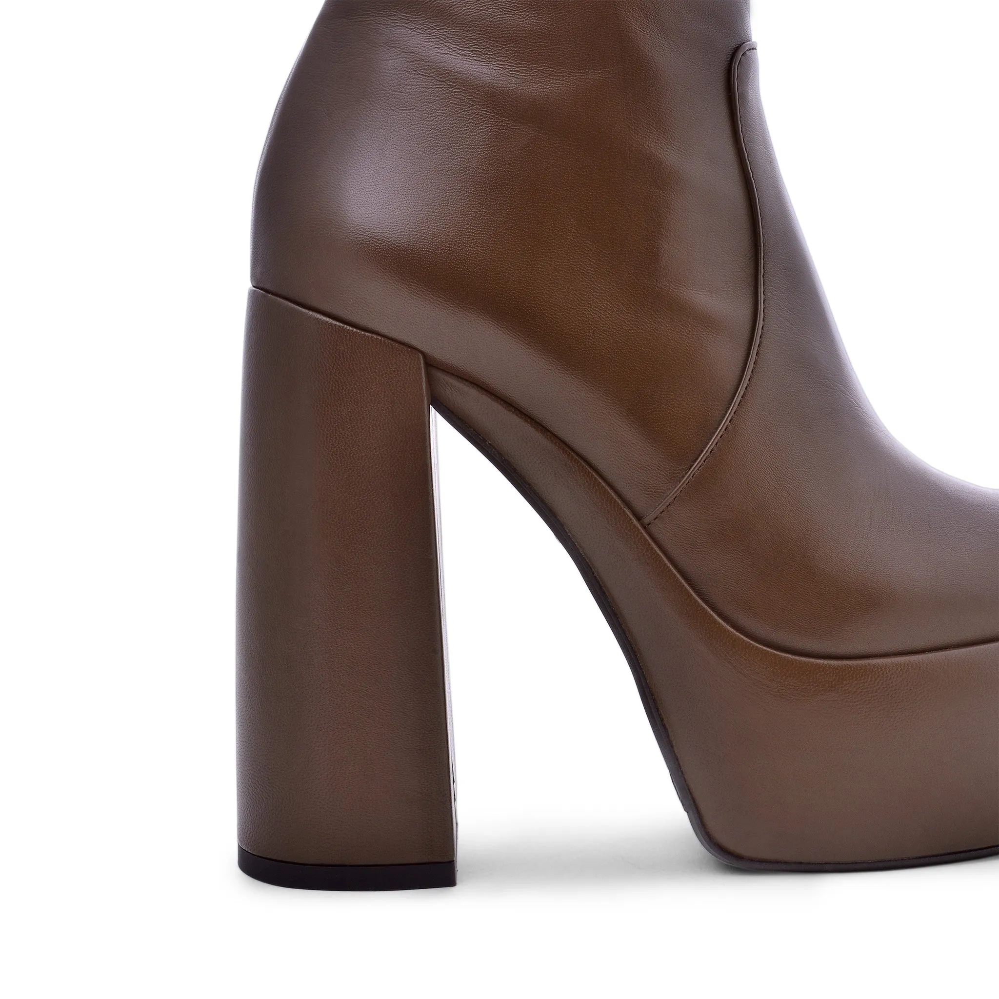 Sato Brown Platform Ankle Boots can be rewritten as Brown Platform Ankle Boots by Sato for improved search engine optimization.