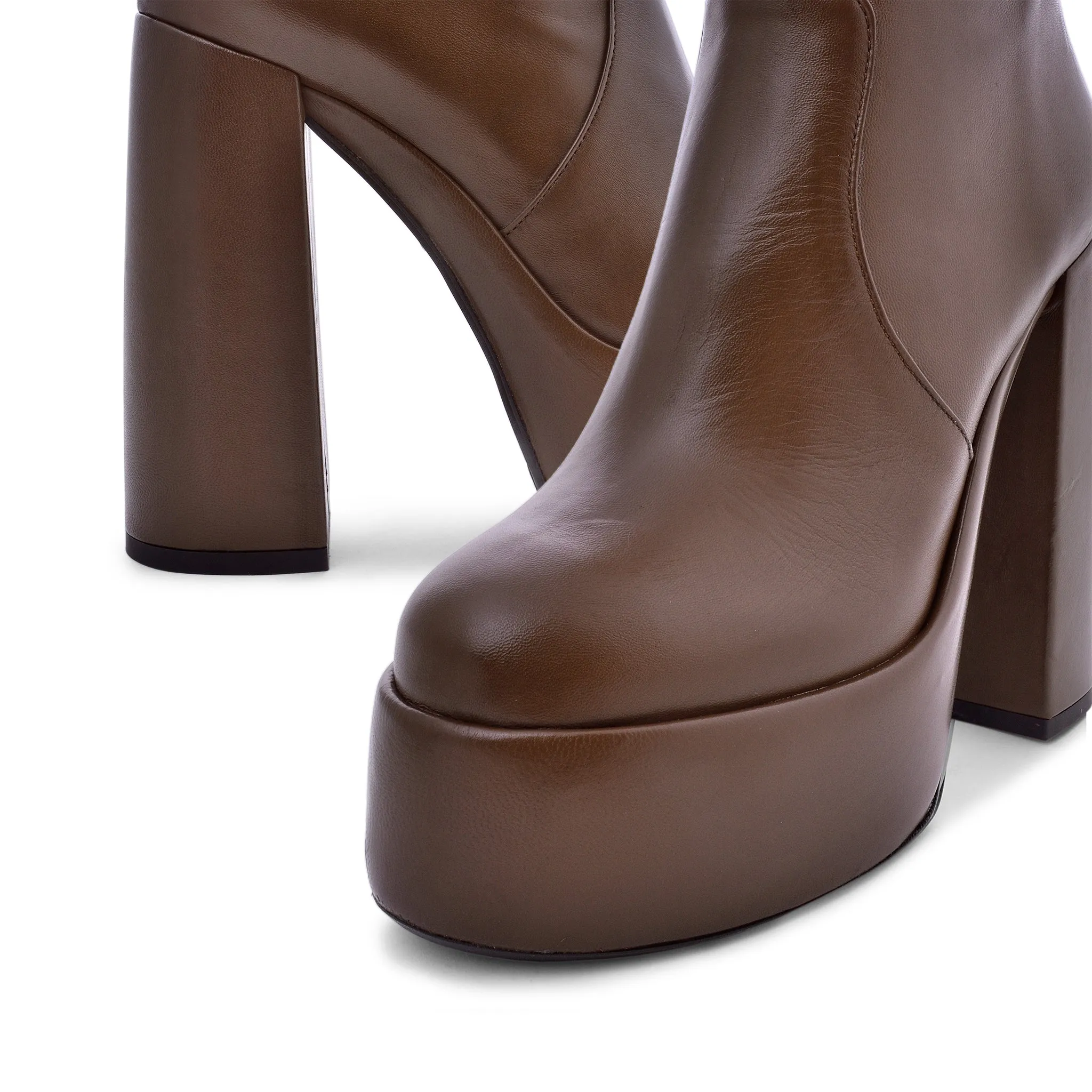 Sato Brown Platform Ankle Boots can be rewritten as Brown Platform Ankle Boots by Sato for improved search engine optimization.